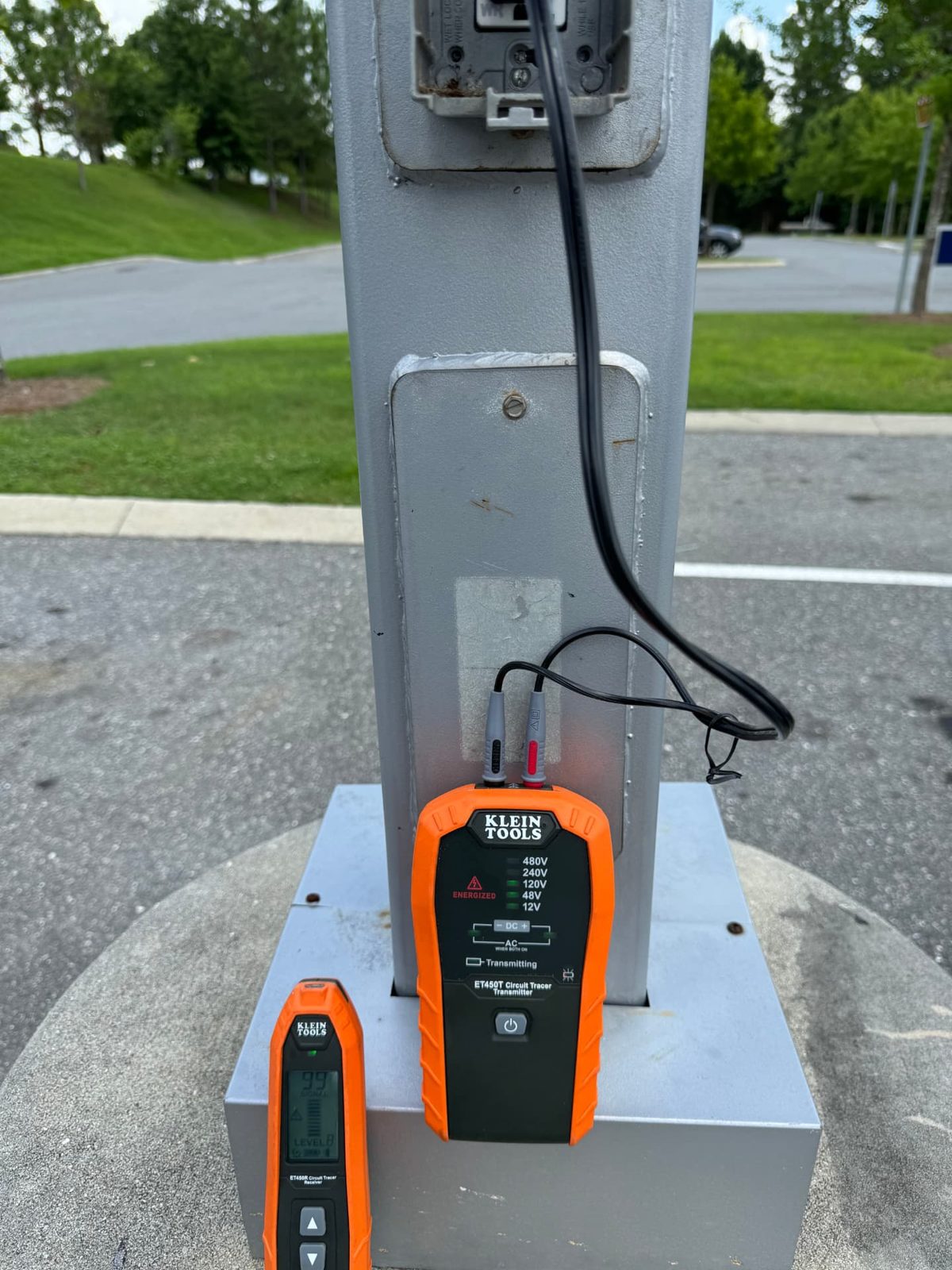 Circuit tracer locating an underground fault on a parking lot circuit