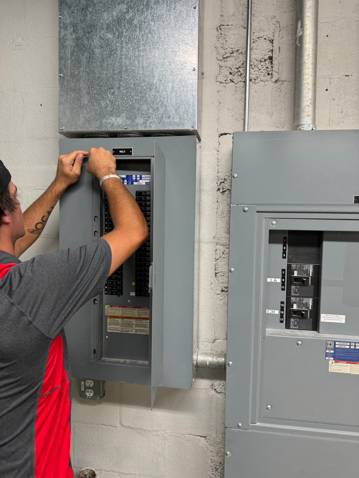 Fraser Electric electrician troubleshooting an open breaker panel in Tallahassee